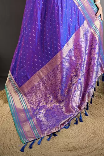 purple silk blend zari woven saree with unstitched blouse piece.