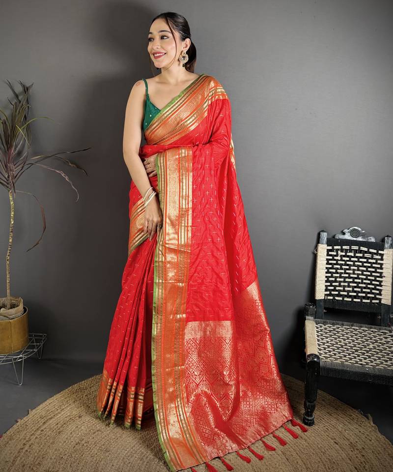 red silk blend zari woven saree with unstitched blouse piece.