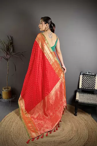 red silk blend zari woven saree with unstitched blouse piece.
