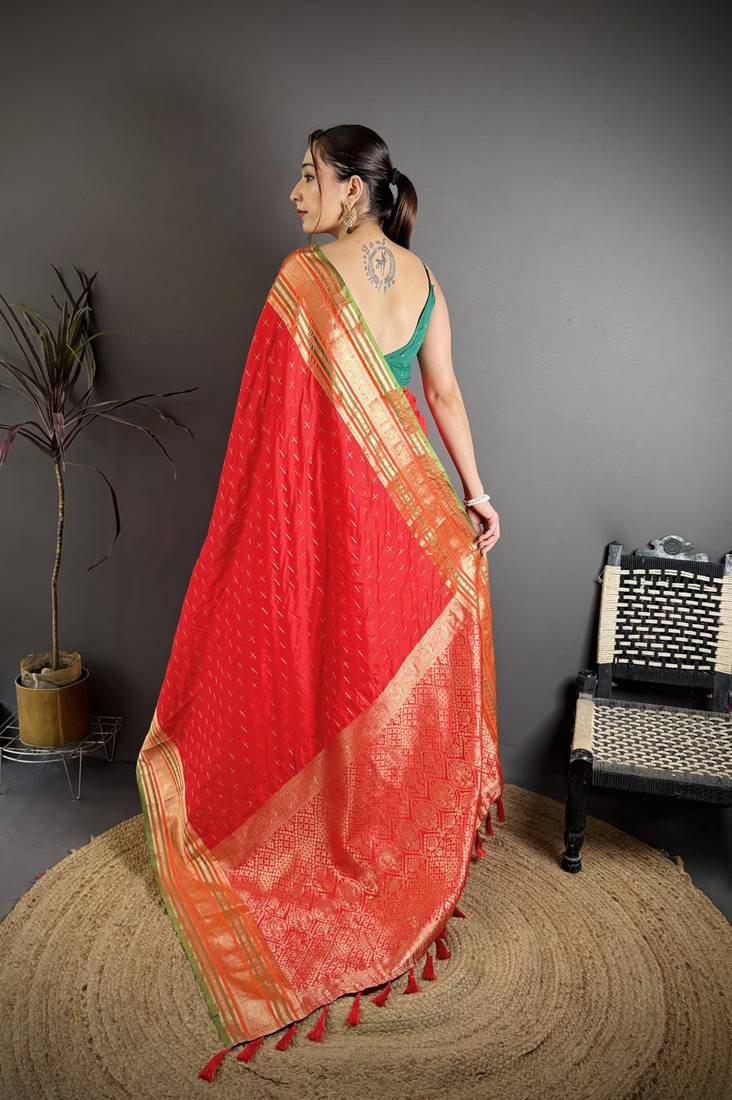 red silk blend zari woven saree with unstitched blouse piece.