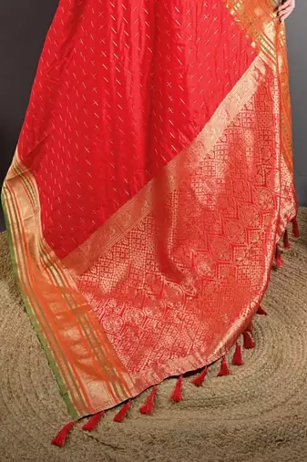 red silk blend zari woven saree with unstitched blouse piece.