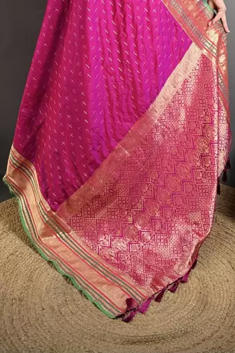 wine silk blend zari woven saree with unstitched blouse piece.