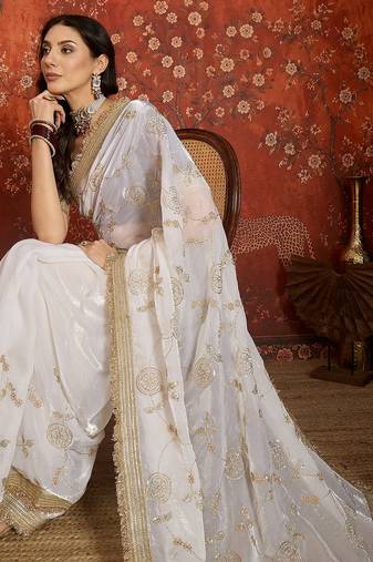 Cream tissue satin embroidered sequin saree with unstitched blouse piece