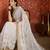 Cream tissue satin embroidered sequin saree with unstitched blouse piece.