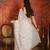 Cream tissue satin embroidered sequin saree with unstitched blouse piece.