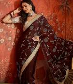 Maroon tissue satin embroidered sequin saree with unstitched blouse piece.