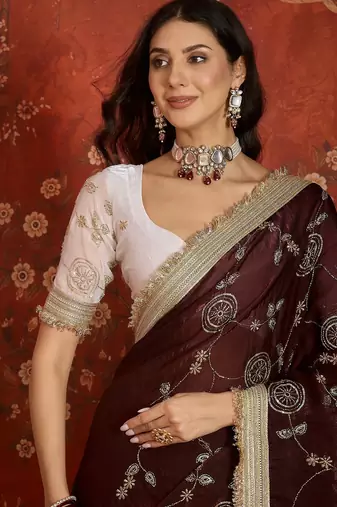 Maroon tissue satin embroidered sequin saree with unstitched blouse piece.