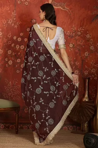 Maroon tissue satin embroidered sequin saree with unstitched blouse piece.