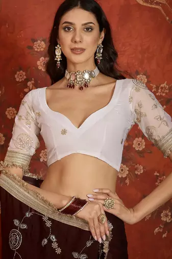 Maroon tissue satin embroidered sequin saree with unstitched blouse piece.
