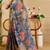 Blue shimmer printed zari saree with unstitched blouse piece.