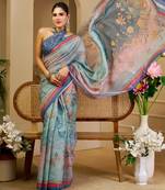 Blue shimmer printed zari saree with unstitched blouse piece.