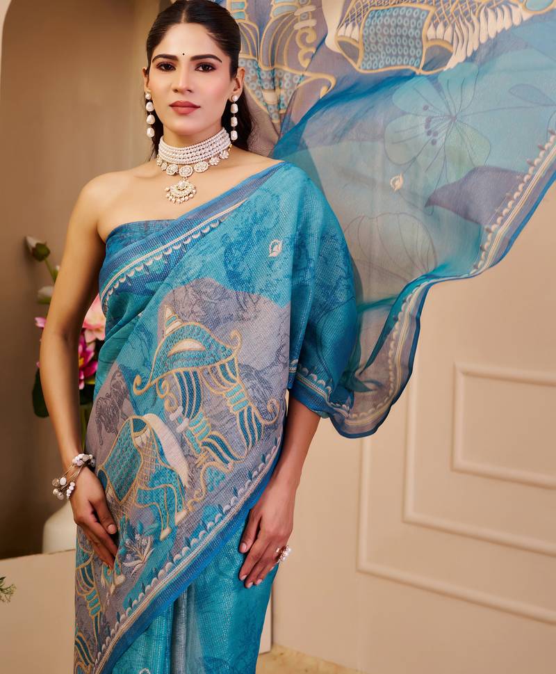 Blue shimmer printed zari saree with unstitched blouse piece.