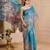 Blue shimmer printed zari saree with unstitched blouse piece.