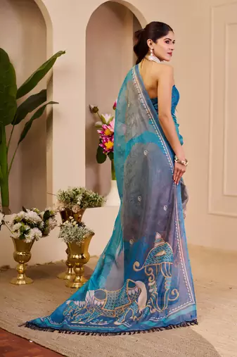 Blue shimmer printed zari saree with unstitched blouse piece.
