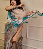 Grey shimmer printed zari saree with unstitched blouse piece.