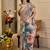 Grey shimmer printed zari saree with unstitched blouse piece.
