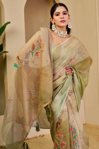 Green shimmer printed zari saree with unstitched blouse piece.