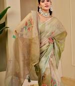 Green shimmer printed zari saree with unstitched blouse piece.