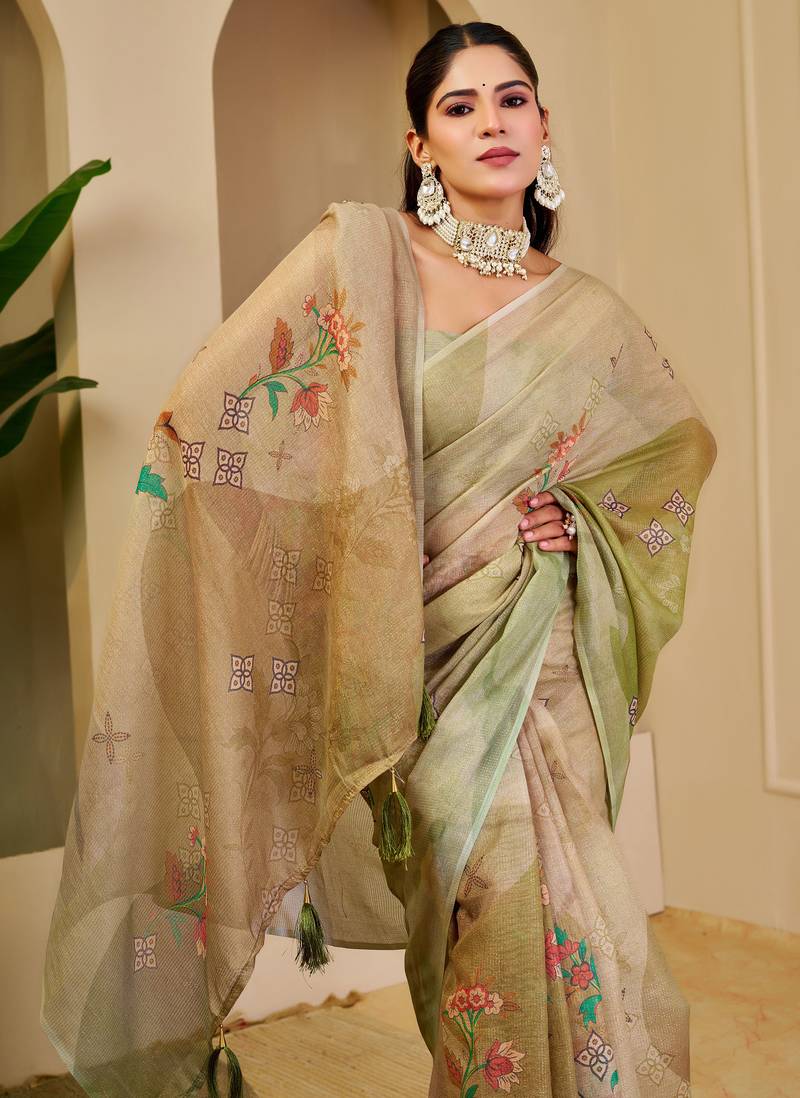 Green shimmer printed zari saree with unstitched blouse piece.