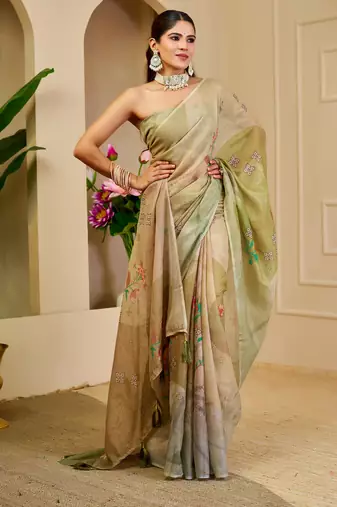 Green shimmer printed zari saree with unstitched blouse piece.