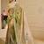 Green shimmer printed zari saree with unstitched blouse piece.