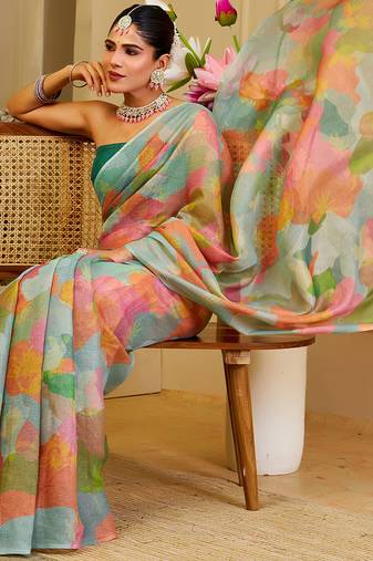 Sea green shimmer printed zari saree with unstitched blouse piece.