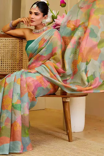 Sea green shimmer printed zari saree with unstitched blouse piece.