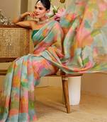 Sea green shimmer printed zari saree with unstitched blouse piece.