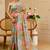 Sea green shimmer printed zari saree with unstitched blouse piece.