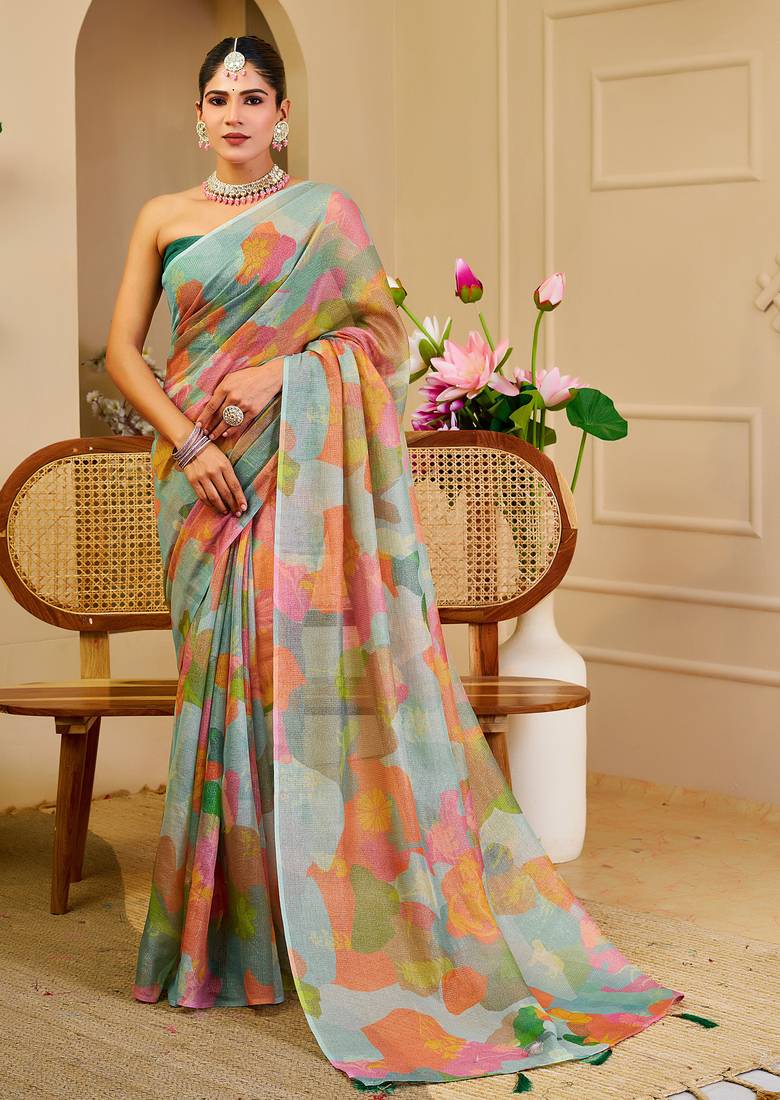 Sea green shimmer printed zari saree with unstitched blouse piece.