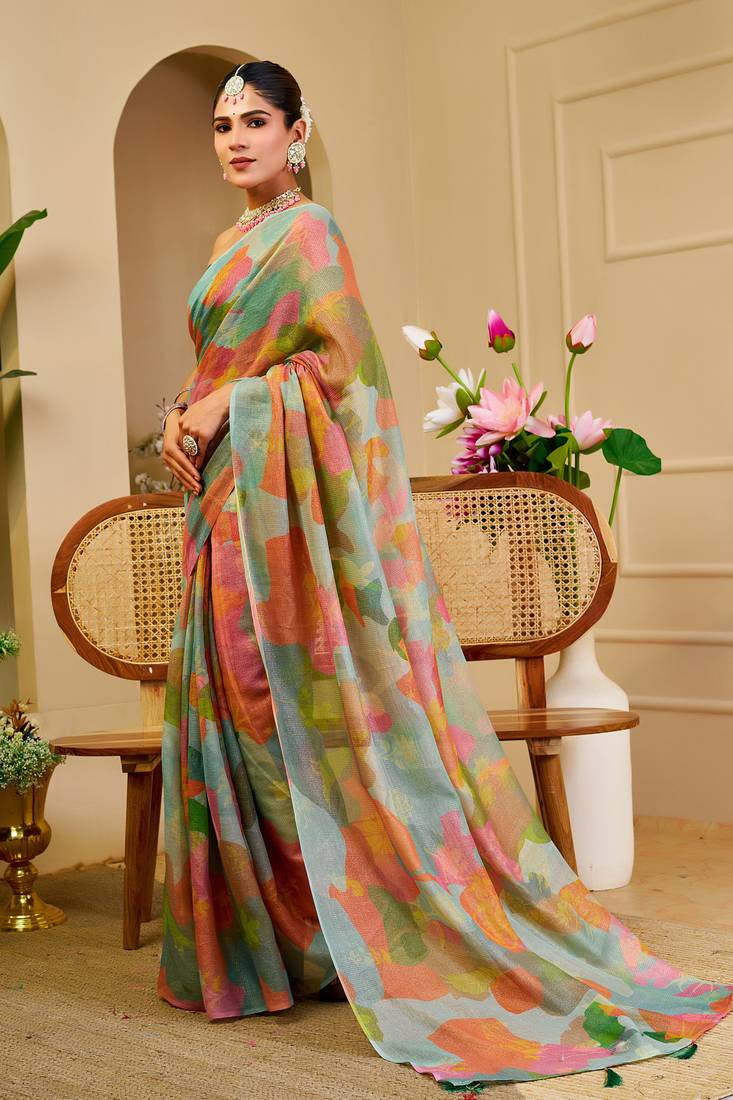 Sea green shimmer printed zari saree with unstitched blouse piece.