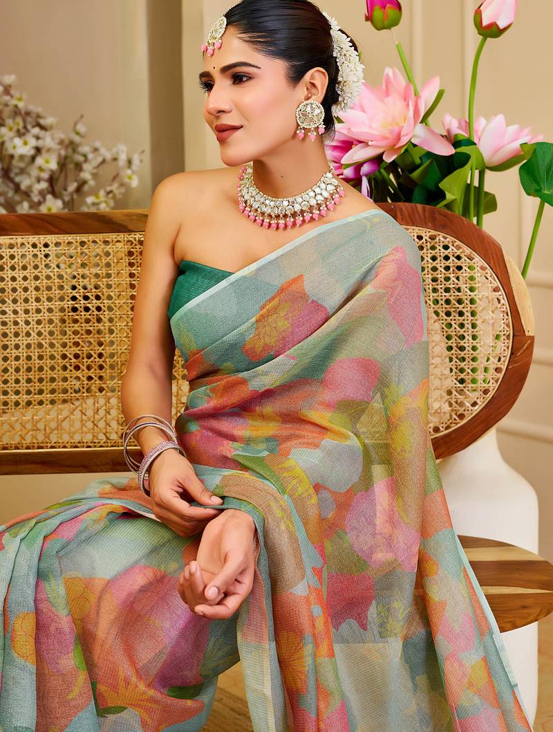 Sea green shimmer printed zari saree with unstitched blouse piece.