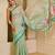 Turquoise shimmer printed zari saree with unstitched blouse piece.