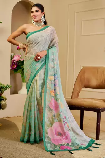Turquoise shimmer printed zari saree with unstitched blouse piece.