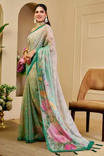 Turquoise shimmer printed zari saree with unstitched blouse piece.