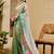 Turquoise shimmer printed zari saree with unstitched blouse piece.