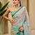Turquoise shimmer printed zari saree with unstitched blouse piece.