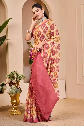 Pink shimmer printed zari saree with unstitched blouse piece.