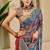 Navy blue shimmer printed zari saree with unstitched blouse piece.