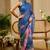 Blue shimmer printed zari saree with unstitched blouse piece.