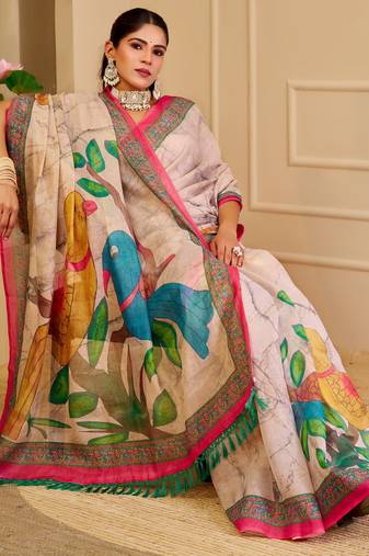 Beige shimmer printed zari saree with unstitched blouse piece.