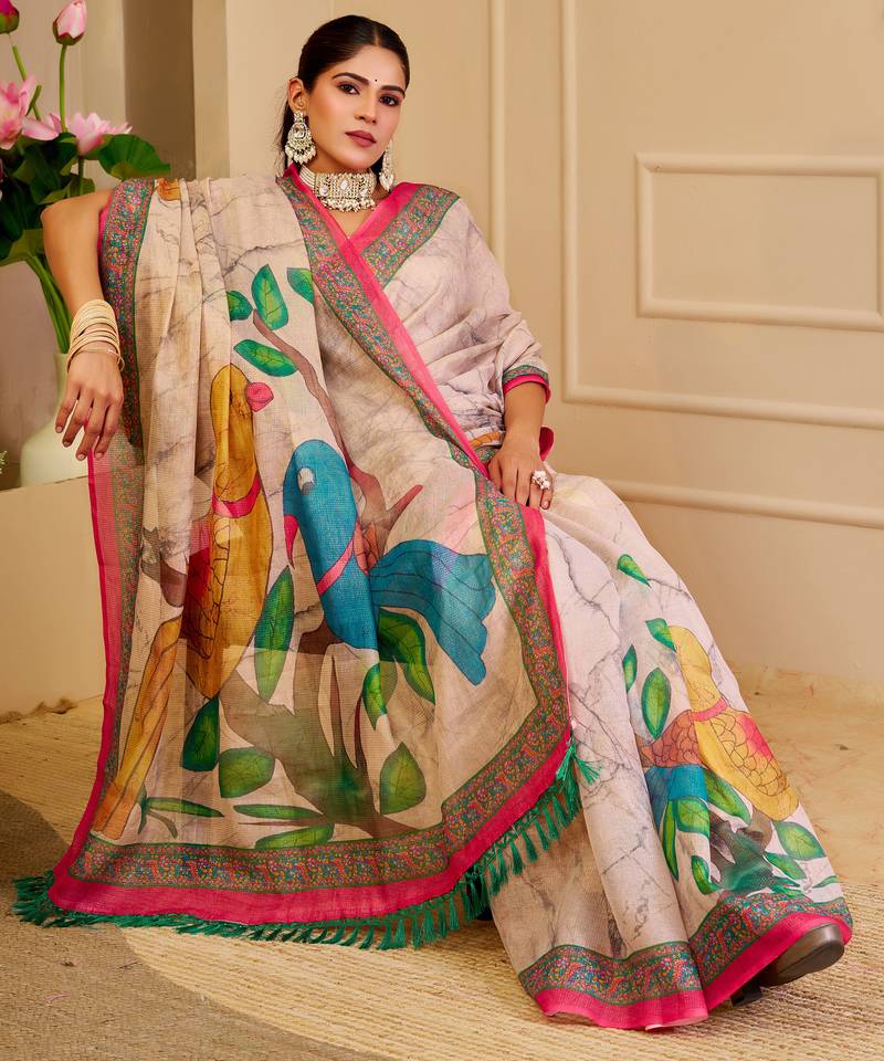 Beige shimmer printed zari saree with unstitched blouse piece.