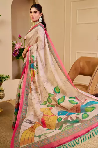 Beige shimmer printed zari saree with unstitched blouse piece.