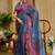 Blue shimmer printed zari saree with unstitched blouse piece.
