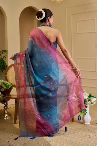 Blue shimmer printed zari saree with unstitched blouse piece.