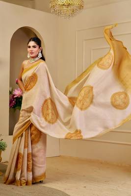 Beige shimmer printed zari saree with unstitched blouse piece. 1