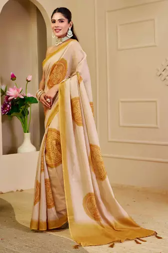 Beige shimmer printed zari saree with unstitched blouse piece.