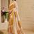 Beige shimmer printed zari saree with unstitched blouse piece.