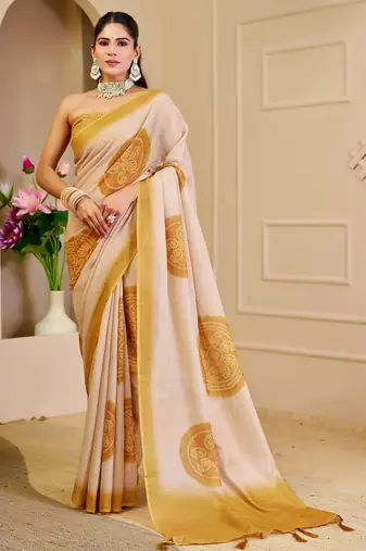 Beige shimmer printed zari saree with unstitched blouse piece.