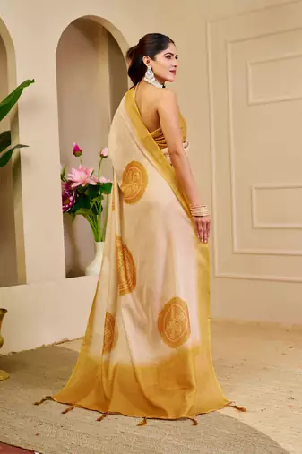 Beige shimmer printed zari saree with unstitched blouse piece.